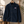 Surchemise navy en velours bio  brodée HONO surfwear français posée sur une échelle