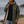 Imperméable chaud kaki HONO doublé polaire avec capuche et broderie jaune, porté par un homme sur la plage, surfwear bio écoresponsable et marque surf française