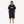 Poncho de surf noir en coton bio HONO avec logo blanc brodé, porté par un homme, vue de face, surfwear français durable et éco-responsable